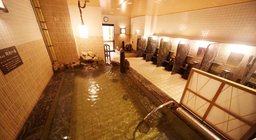 a large swimming pool in a large building, Dormy Inn Premium Nagoya Sakae Natural Hot Spring in Nagoya