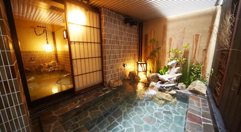 a bath room with a tub and a sink in it, Dormy Inn Premium Nagoya Sakae Natural Hot Spring in Nagoya