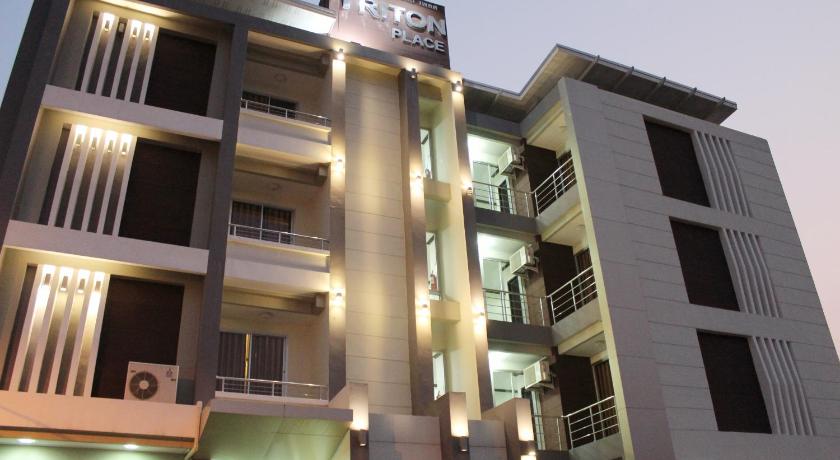 a large building with a large window in front of it, Triton Place in Nakhonratchasima