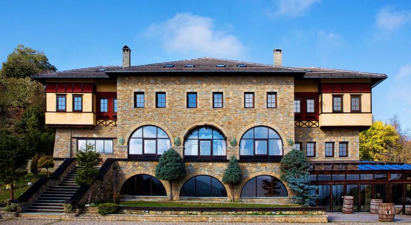 a large building with a large window in front of it, Valia Nostra Escape Hotel in Smixi (Grevena)