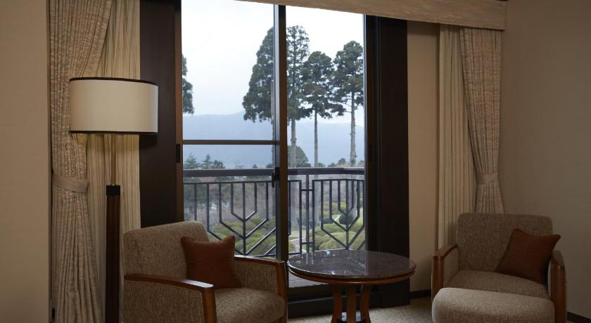 a living room filled with furniture and a window, Odakyu Hotel de Yama Hakone Lake Side in Hakone