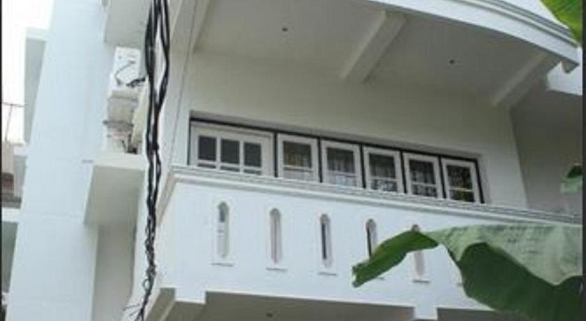 a large white building with a large window, The Fort Bungalow in Kochi
