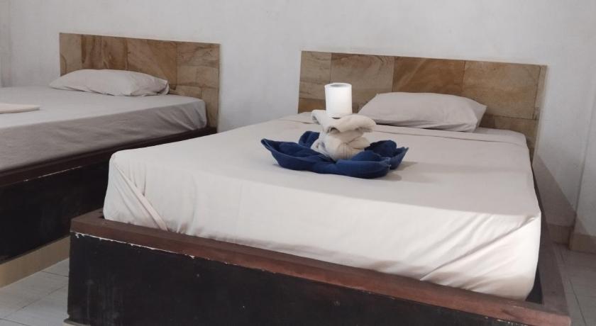 Amed Stop Inn Homestay, Rooftop Restaurant and Bar photo