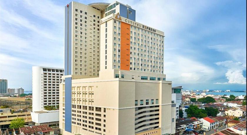 a large building with a large clock tower, Cititel Express Penang Hotel in Penang