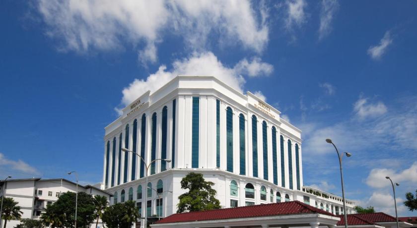 a tall building with a clock on the top of it, Berjaya Waterfront Hotel in Johor Bahru