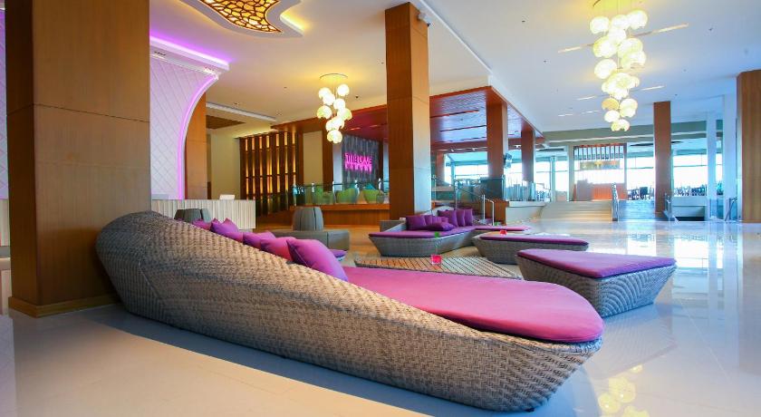 a large room with a couch, chairs, and tables, The Senses Resort & Pool Villas Phuket (SHA Plus+) in Phuket
