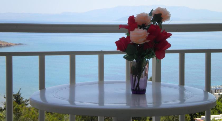 a vase filled with flowers on top of a table, Chios Rooms MyView in Chios
