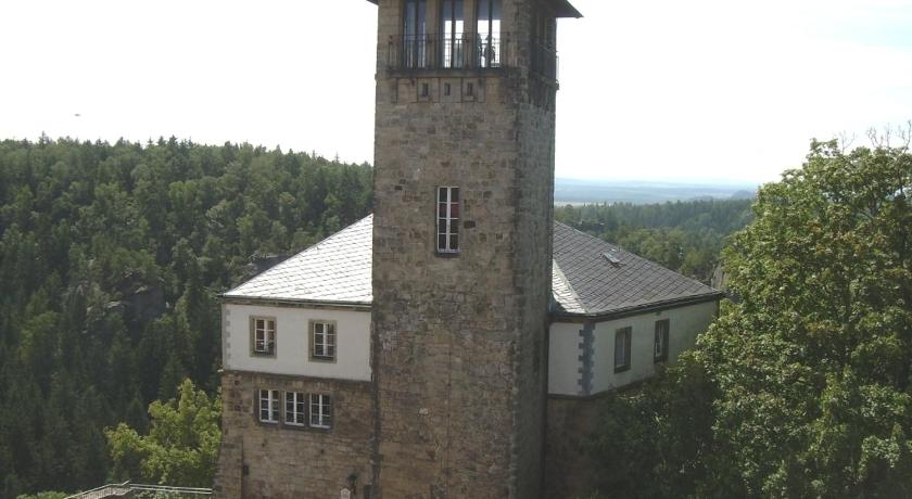 a clock tower on top of a building, Herberge Burg Hohnstein in Hohnstein