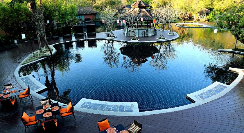 a patio area with tables, chairs and umbrellas, Sibsan Resort & Spa Maetaeng SHA in Chiang Mai
