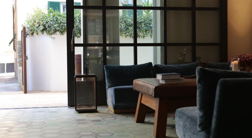 a living room filled with furniture and a window, Hotel Blu di Te in Santa Margherita Ligure
