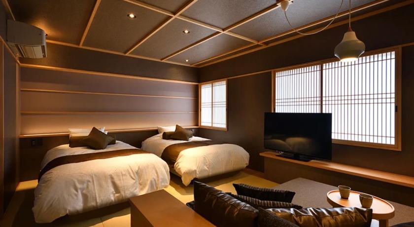 Image of TAKE Deluxe Room with Private Bathroom and Dining Room 0