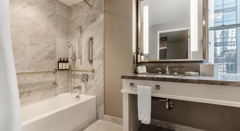 Image of DELUXE ROOM 2 Double - 430sf, 39sm. City view, large marble bathroom with rain shower 2