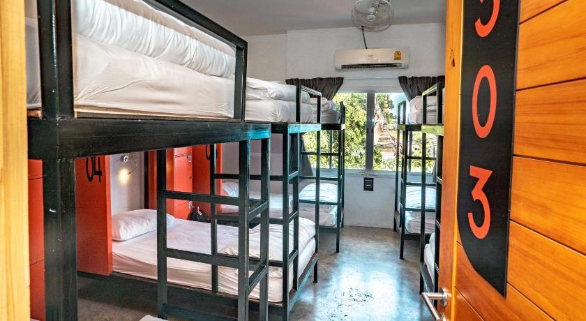 Image of Bed in 12 Bed Mixed AC Dormitory Room with Shared Bathroom 0
