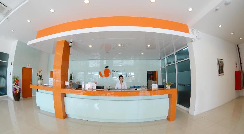 a large room with a large counter and a large window, Original Orange Hotel in Nakhon Si Thammarat