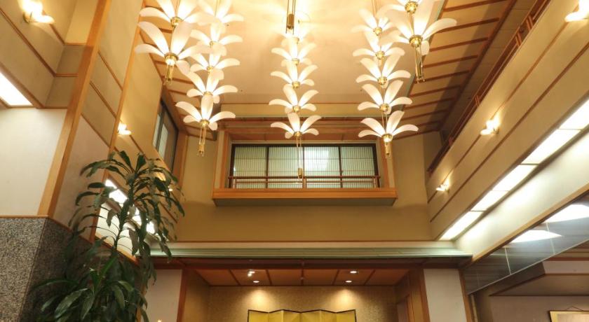 a large room with a large clock on the ceiling, Hotel Futaba in Yuzawa