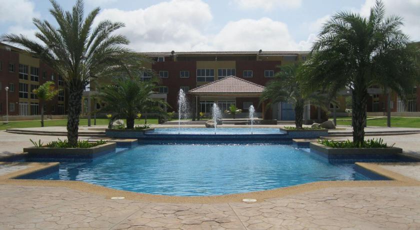 a large swimming pool in front of a large building, Villa La Blanquilla in Margarita Island