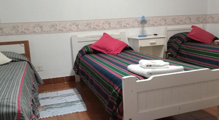 Image of Triple Room with Shared Bathroom 0
