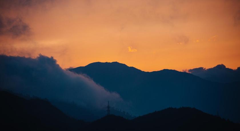 a mountain range with a sky background, Sterling Darjeeling in Darjeeling