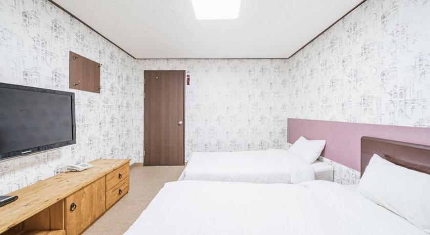 チェジュ New Manhattan Hotel 2つ星 ホテル レストラン