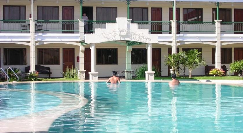 a man is swimming in a swimming pool, Dotties Place Hotel and Restaurant in Butuan