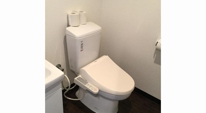 a white toilet sitting next to a white sink, Mr.Kinjo Violette in Okinawa Main island