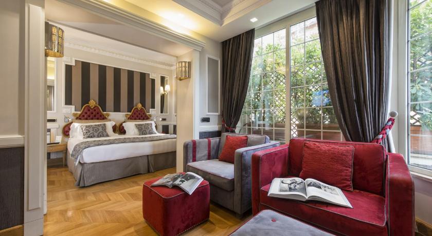 a hotel room filled with furniture and a bed, THE BRITANNIA HOTEL in Rome