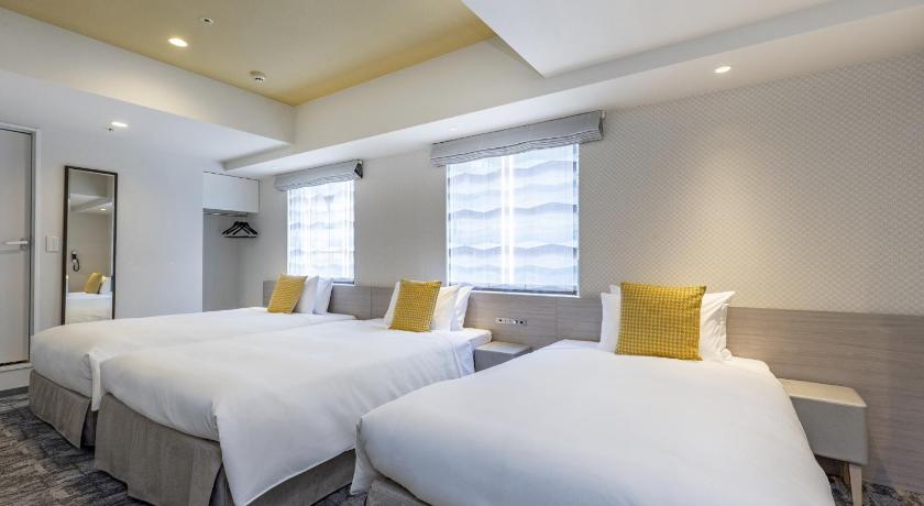 Image of Superior Twin Room and In-room  Washer-Dryer 3Adult 1