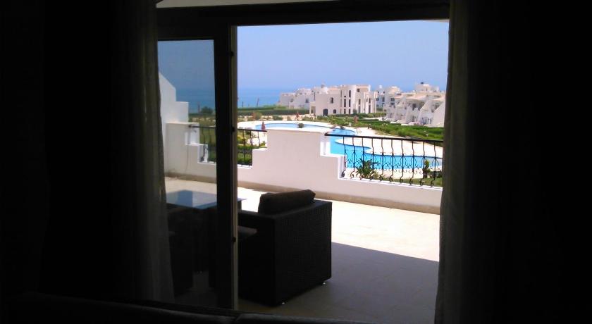 Balcony/terrace, Three-Bedroom Apartment at Louly Beach Resort in Ataqah