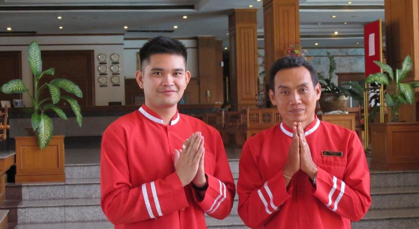 two men standing next to each other in a room, Rimpao Hotel in Kalasin