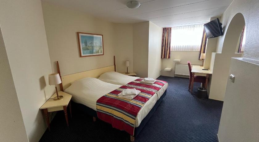 Image of Standaard kamer met douche en extra bed in het souterrain 1