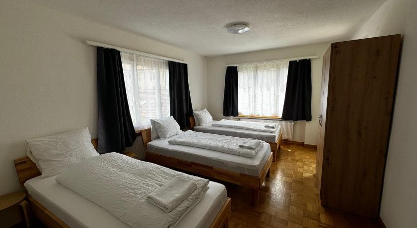 Image of Triple Room with Shared Bathroom 0