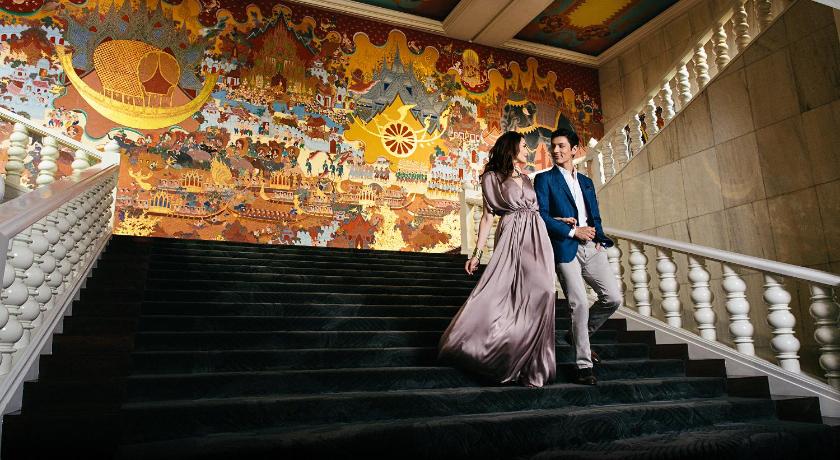 a bride and groom walk down a staircase, Anantara Siam Bangkok Hotel (SHA Certified) (SHA Plus+) in Bangkok