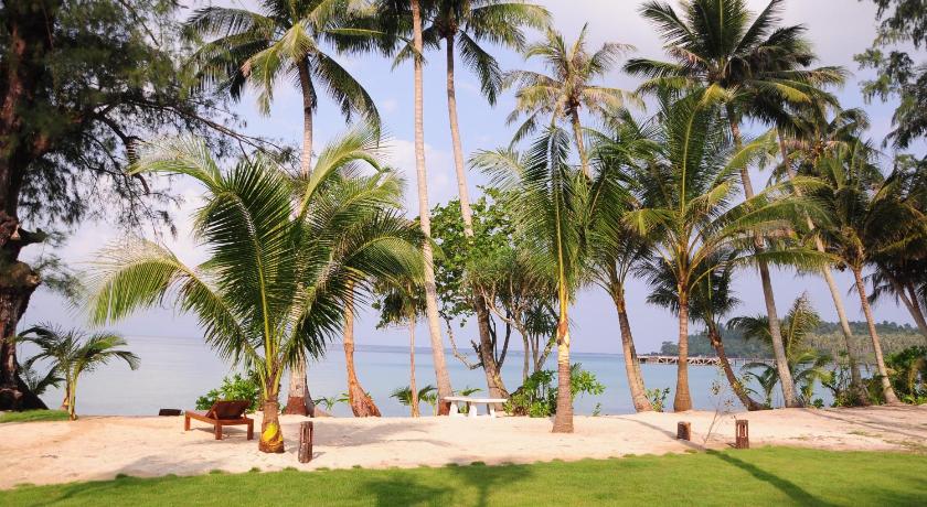a beach with palm trees and palm trees, Medee Resort (SHA Certified) in Koh Kood