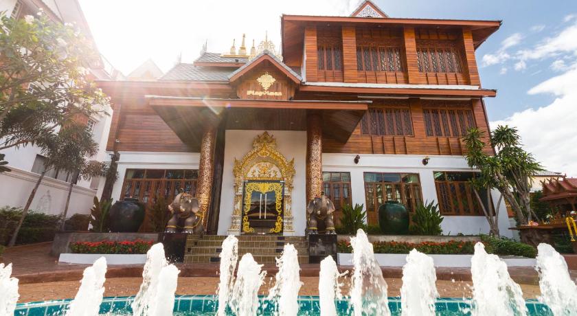 a white house with a clock on the front of it, Pingviman Hotel (SHA Extra Plus) in Chiang Mai