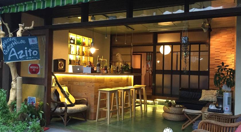 a restaurant with a patio area with chairs, tables and umbrellas, Guesthouse Azito in Hakone
