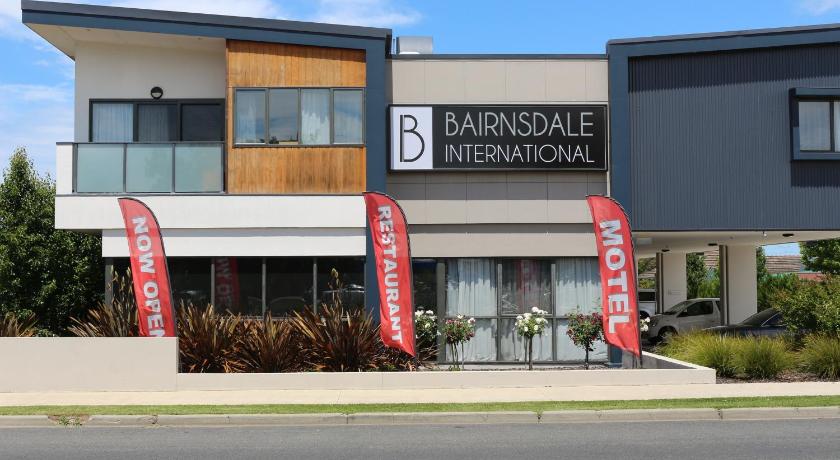 a sign that is on the side of a building, Bairnsdale International Hotel in Gippsland Region