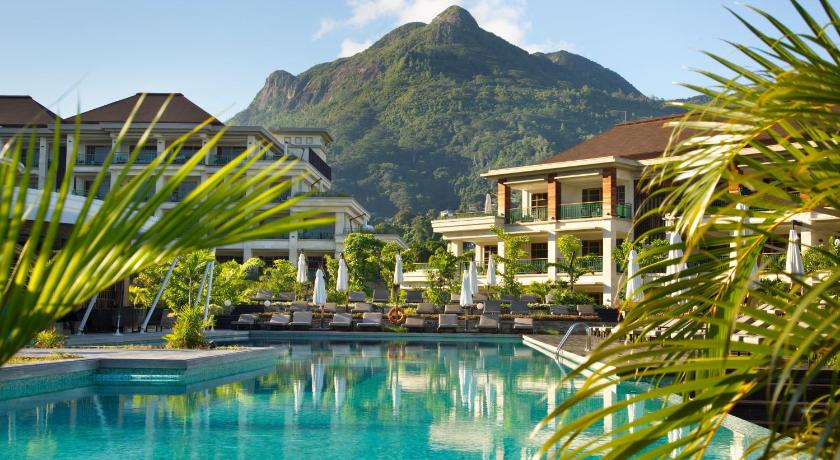 a large swimming pool in a tropical setting, Savoy Resort and Spa in Seychelles Islands
