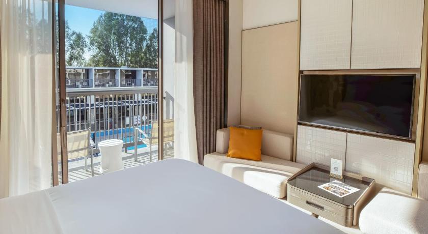 Image of Guest room, 2 Queen, Pool view, Pool access, Balcony 0