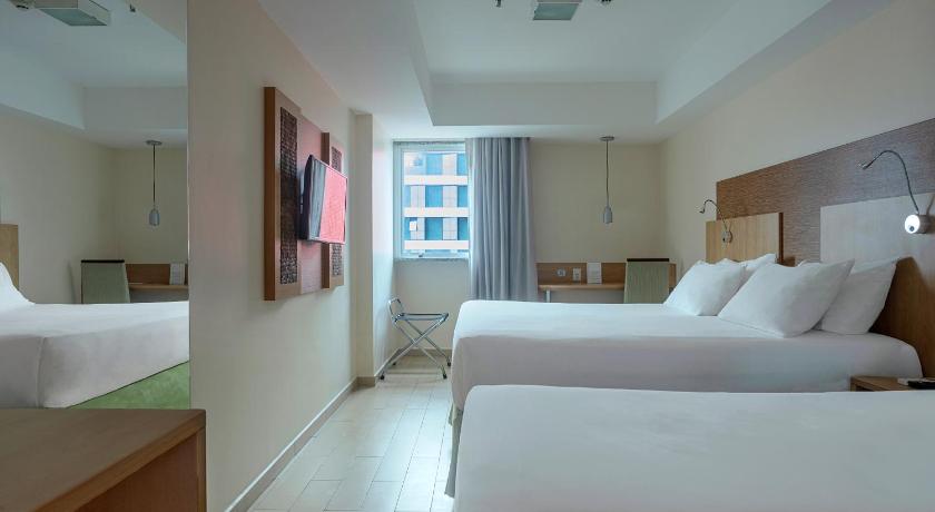 Image of Standard Room with One Double Bed and One Single Bed 1
