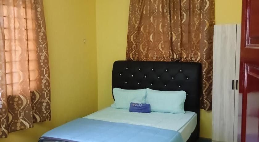 タナ・メラ Impian Jaya Homestay 3つ星 ゲストハウス 客室