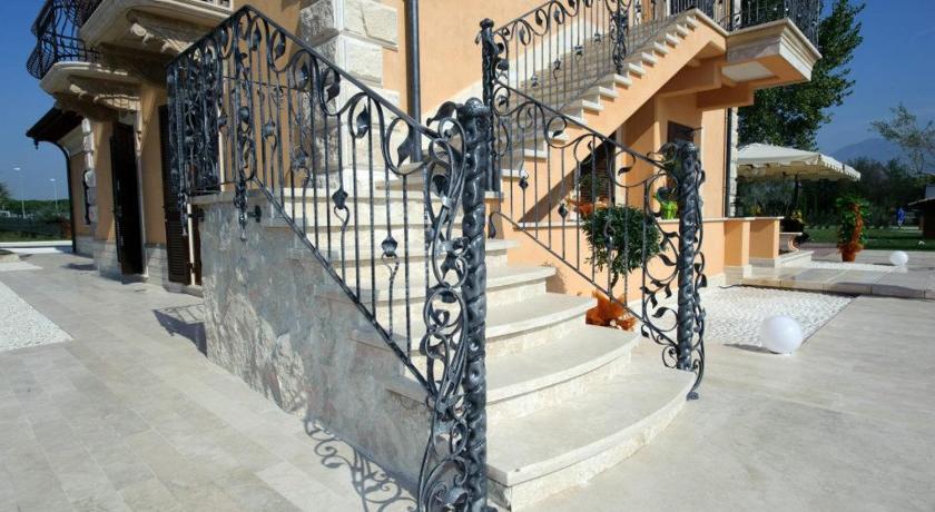 a stairway leading up to a balcony, Villa Tivoli in Guidonia Montecelio