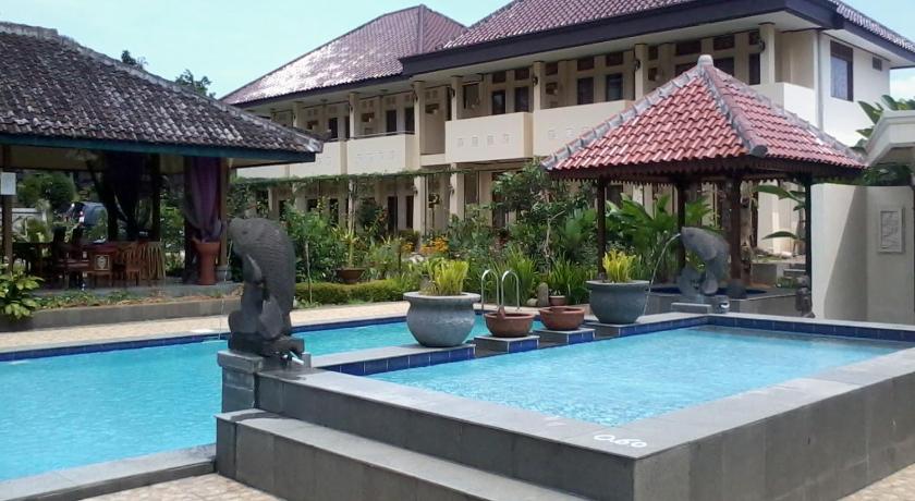 a house with a pool and a pool table in front of it, Taman Teratai Hotel in Puncak