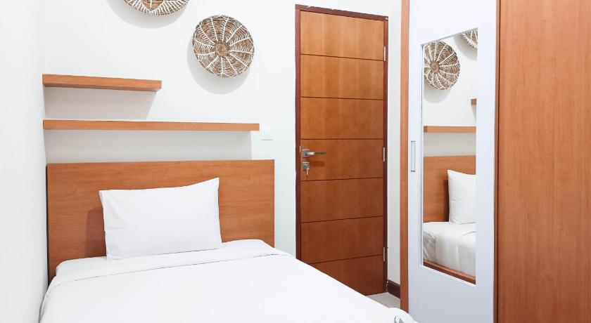 マカッサル SpaciousComfort 3BR Vida View Makassar By Travelio 4つ星 ゲストハウス 客室