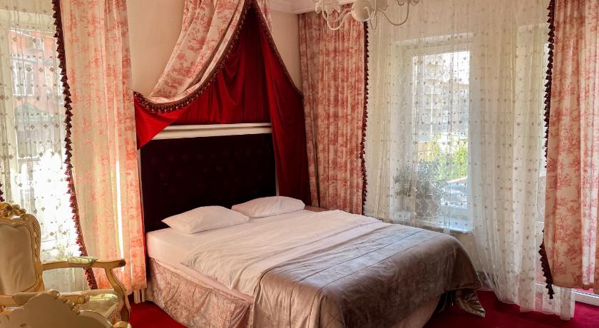 รูปของห้องดีลักซ์เตียงใหญ่พร้อมระเบียง (Deluxe Double Room with Balcony) 3