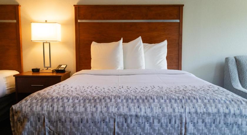 Image of Queen Room with Two Queen Beds w/ fire place & private balcony 5