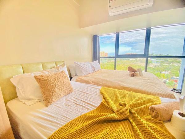 Cebu Mactan Newtown 2 BEDS with POOL access 3-Star Guesthouse suite