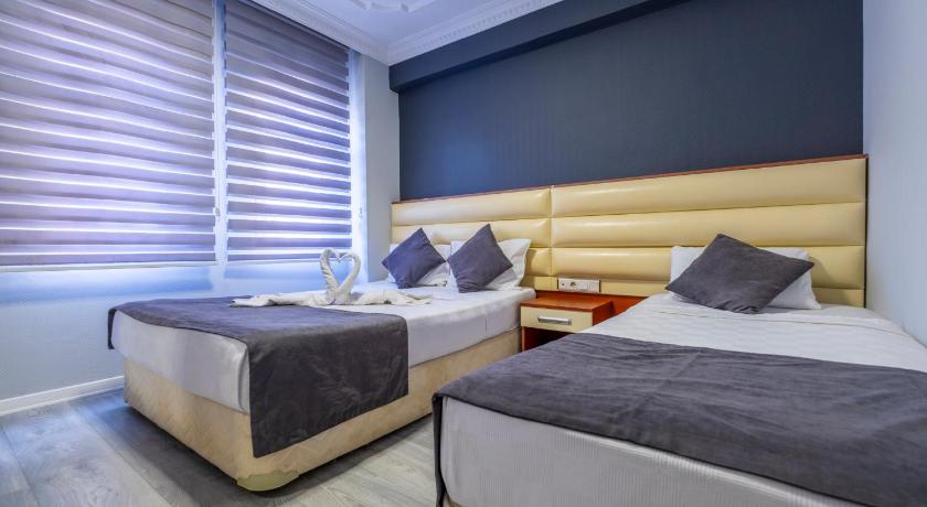 Imatge de Habitació Deluxe Triple (Deluxe Triple Room) 0