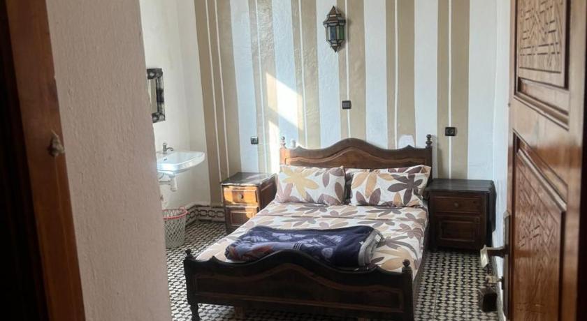 Image of Triple Room with Shared Bathroom 0