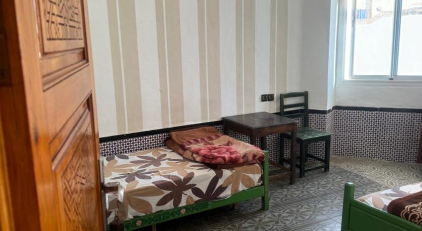 Image of Triple Room with Shared Bathroom 4