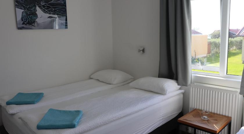 Image of Economy Triple Room with Shared Bathroom 1